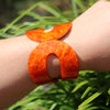 Statement Making Colorful Lucite Hinged Cuff Bangle Bracelet, 7.75" (Marbled Orange With Glitter Flecks, Round)