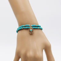 Western Style Aztec Thunderbird 4mm Turquoise Howlite Bead Stretch Bracelet (Gold Tone)