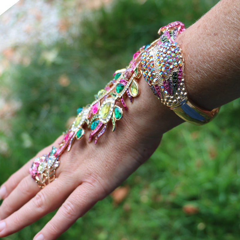 Vibrant And Colorful Statement Making Crystal Rhinestone 3D Peacock On Gold Tone Stretch Bangle Bracelet With Attached Ring Hand Chain Combination