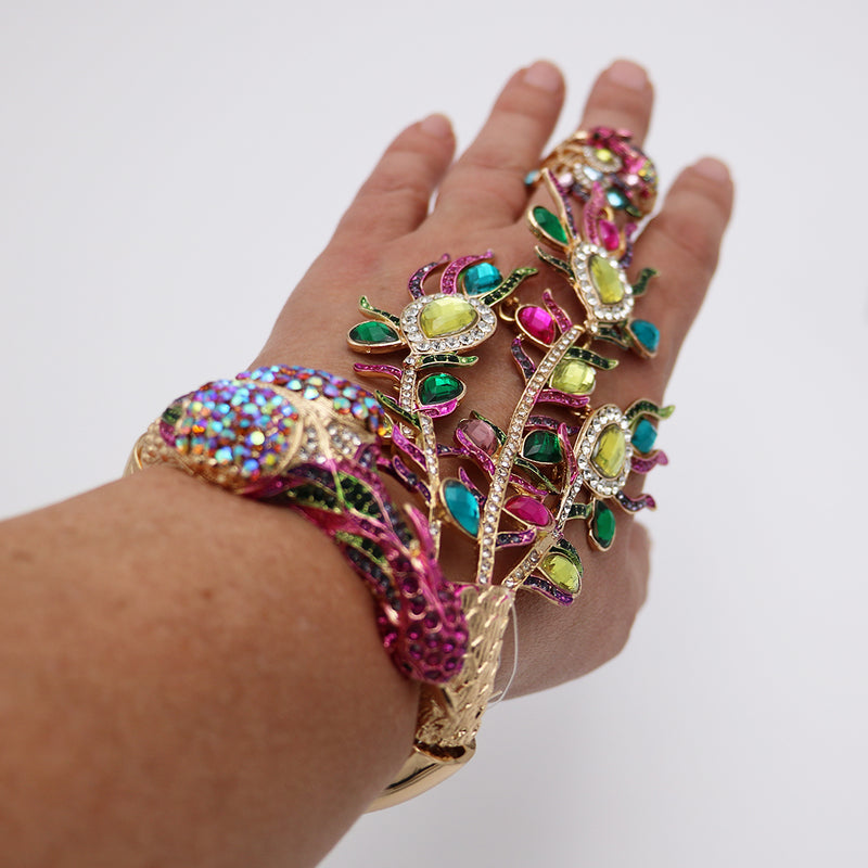 Vibrant And Colorful Statement Making Crystal Rhinestone 3D Peacock On Gold Tone Stretch Bangle Bracelet With Attached Ring Hand Chain Combination